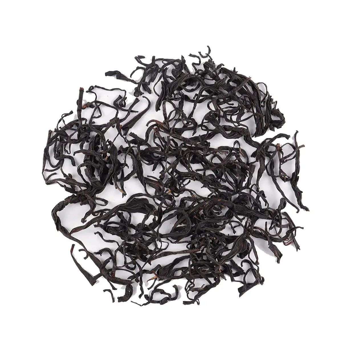 Phoenix Dancong oolong loose tea leaves arranged on a white background.