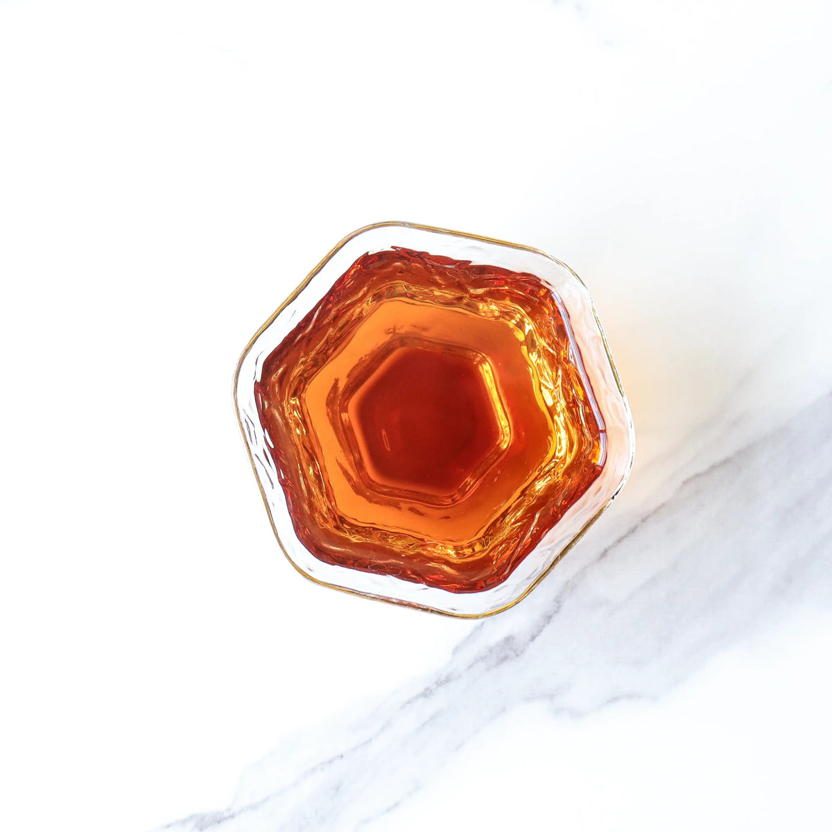 Amber liquor brewed from CHICHATEA Mini Ripened Pu-erh Tea Cakes
