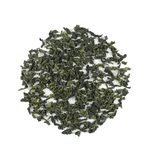Tie Guan Yin Oolong Tea by My Store features loose leaves arranged in a circle on a white background, highlighting their signature orchid aroma.