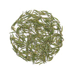 Loose dried Zhu Ye Qing Green Tea leaves from My Store arranged in a circle on a white background, highlighting this premium Chinese tea's fresh flavor and wellness benefits.